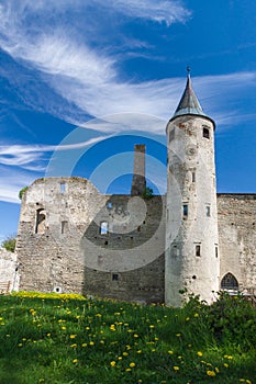 Medieval castle under blue cloudy sky