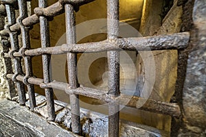 Medieval cellar prison iron bars grate