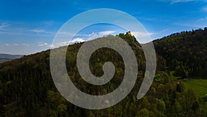 Medieval Chojnik Castle atop Karkonosze mountain in aerial shot