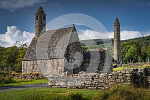 Medieval church, ancient graves, Celtic crosses in Glendalough Cemetery, Ireland