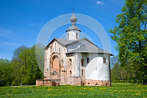 Medieval church in honor of sacred Paraskev Fridays on Yaroslav`s Court in the sunny May afternoon. Veliky Novgorod, Russia