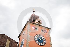 Medieval church steeple with big clock