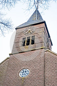 Medieval church tower in the historical village of Gelselaar, Netherlands