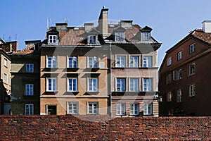 The medieval city wall and amazing old facade buildings in the Old Town of Warsaw city