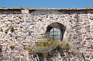 Medieval city wall with window