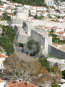 Medieval city walls and clay tiled roofs