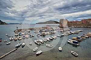 Medieval city walls and yacht harbor in the city of Dubrovnik