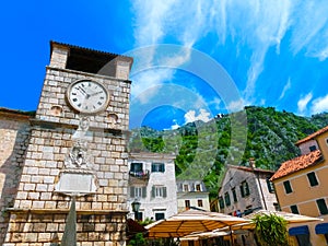 Medieval clock tower in Kotor in a beautiful summer day