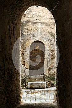 Medieval cobblestone street in the famous Saint Guilhem le Desert village