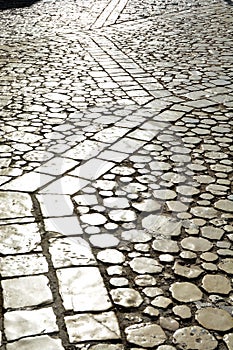 Medieval cobblestone street with very old stones