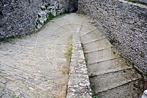 Medieval cobblestone street with very old stones