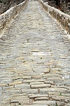 Medieval cobblestone street with very old stones