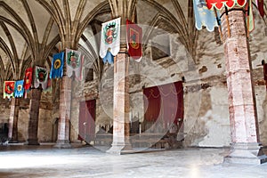 Medieval conference room with flags