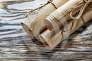 Medieval corded paper rolls on wooden board