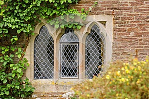 Medieval cottage window with leaded glass