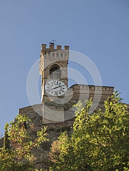 Medieval crenellated brick wall Clock tower in Brisighella photo