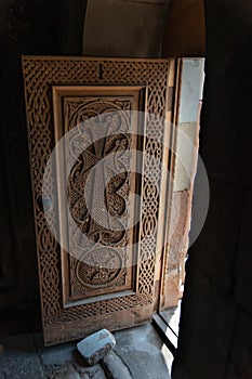 Medieval cross stone door carved out of Tufa in Novarank monastery, armenia