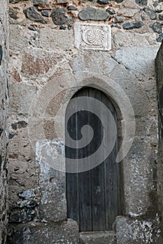 Medieval door of the sun and the moon