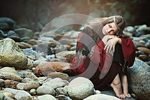 Medieval dressed woman with dreaming expression photo