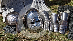 Medieval equipment, helmet, metal glove, armor. Medieval spectacle in times gone by