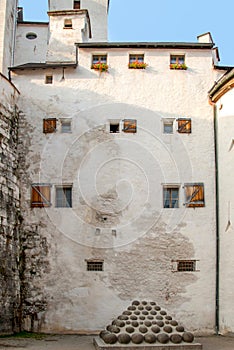 Medieval era fortress Salzburg main building with archaic canon balls