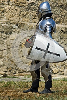 Medieval european knight near citadel