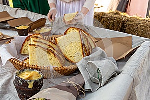 Medieval fast food slice of bread large rustic loaf ceramic bowl of honey and lard with garlic nourishing additive delicious snack