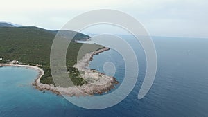 Medieval fortress of Arza on the Mamula peninsula surrounded by greenery. Drone