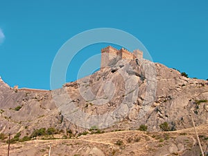 A medieval fortress on a stone rock.