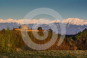 Medieval fortress in Transylvania with the Carpathians in the background