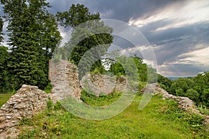 Medieval Halych Castle ruins under stormy sky in Ukraine photo