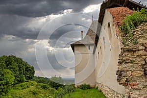 Medieval Halych Castle under stormy sky in Ukraine photo