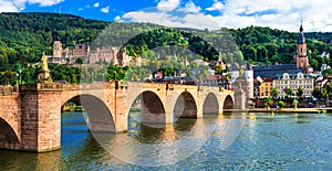 Medieval Heidelberg - view of famous Karl Theodor bridge and ca photo