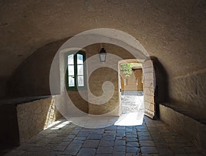 medieval house with barrel vault open door lantern green window