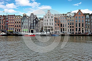 Medieval houses along the river Amstel in Amsterdam Netherlands