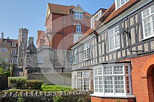 Medieval houses with brickstone and flagstone roofs with Victorian building Purbeck House Hotel in the background, Swanage