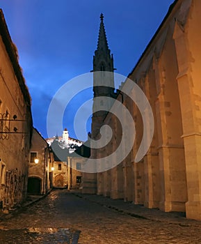 Medieval houses, Convent of the Order of St Clare Nuns Poor Clares on Farska street right and Castle on hill, Bratislava