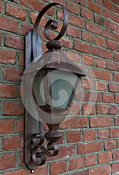 Medieval iron wall lamp on a building