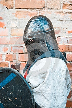 Medieval knight in armor. Head. Helmet. The historical restoration of military events