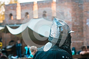 Medieval knight in armor. Head. Helmet. The historical restoration of military events