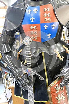 Medieval knight in armor, holding a broadsword photo