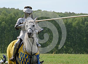 Medieval knight in armor on horseback