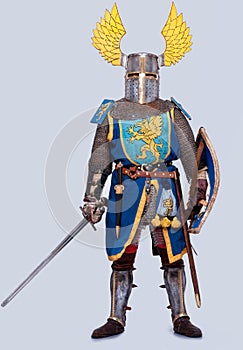 Medieval knight in full armor standing