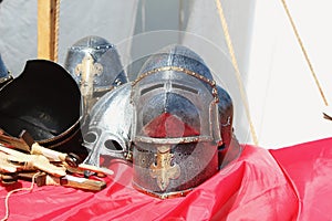 Medieval knight helmets on the table