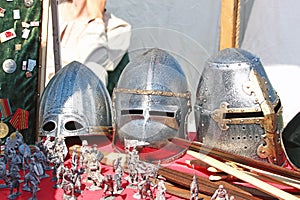 Medieval knight helmets on the table