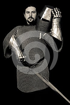 Medieval Knight holding Helmet and sword