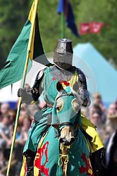 Medieval knight on horseback photo