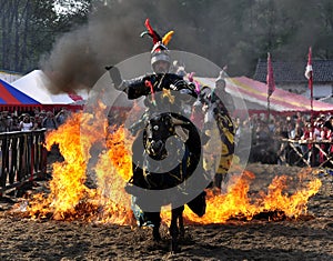 Medieval knight on horseback photo