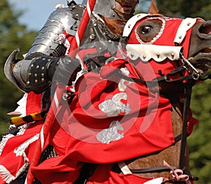 MEDIEVAL KNIGHT RIDING A HORSE photo