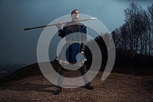 Medieval knight with spear in armor as style Game of Thrones in